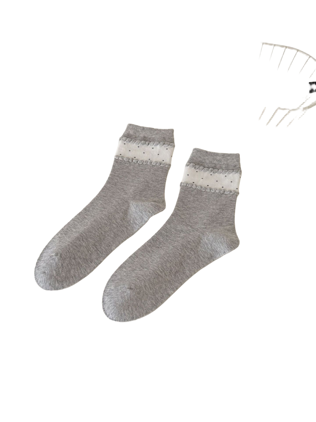 Light Gray crew socks with a white dotted ankle band and raised trim