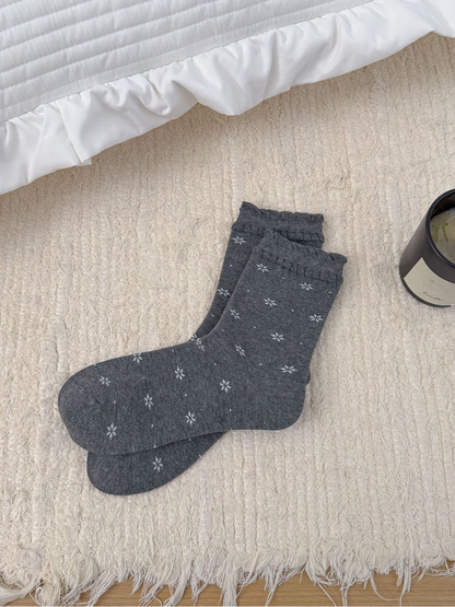 Dark Gray floral crew socks with ruffled cuffs, full product view