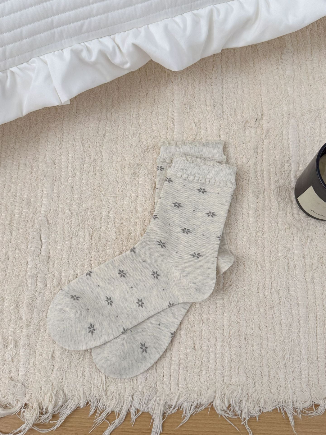 Ivory floral crew socks with ruffled cuffs, full product view