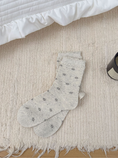 Ivory floral crew socks with ruffled cuffs, full product view