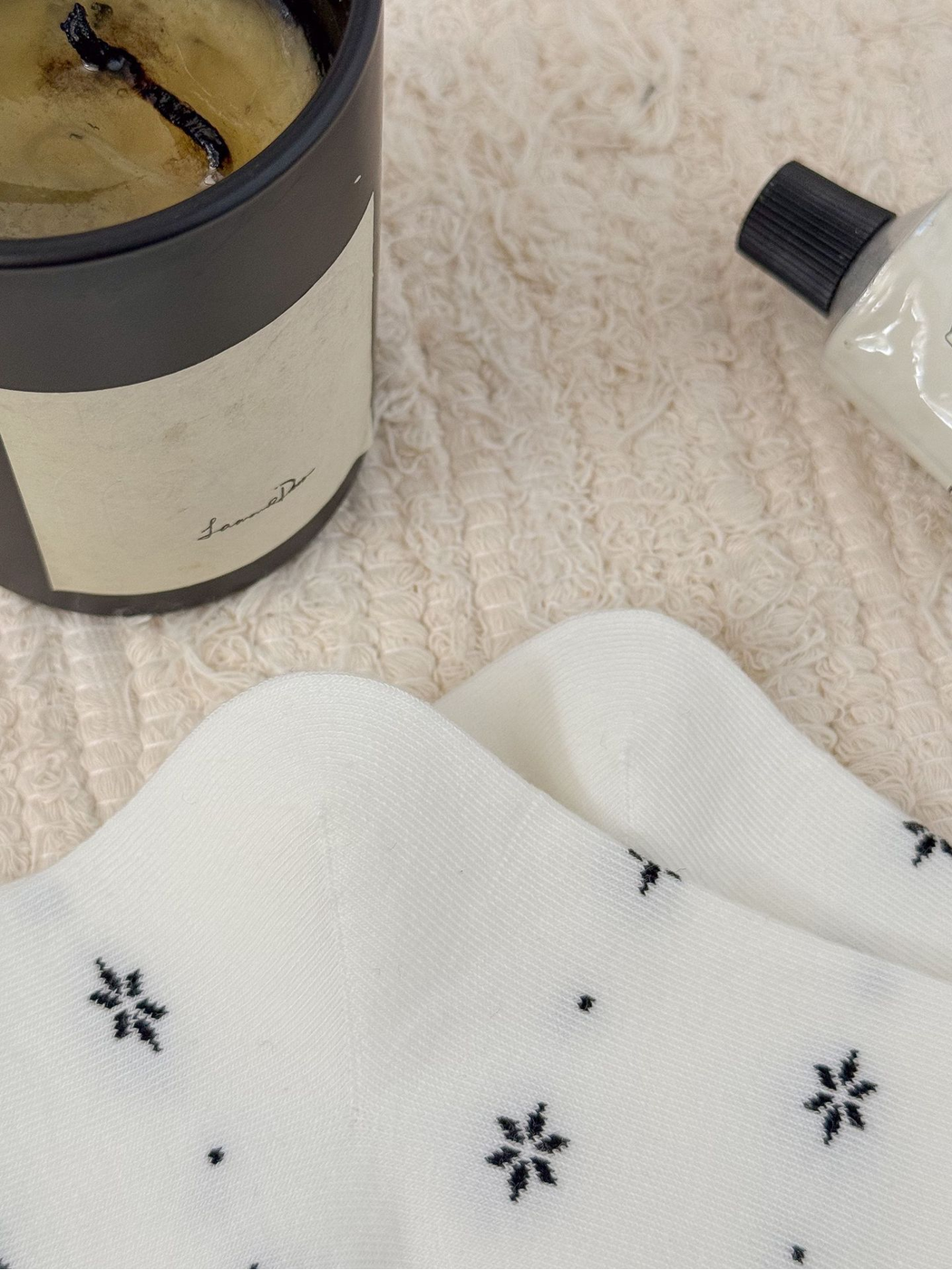 Close-up of the White floral sock pattern and smooth toe area