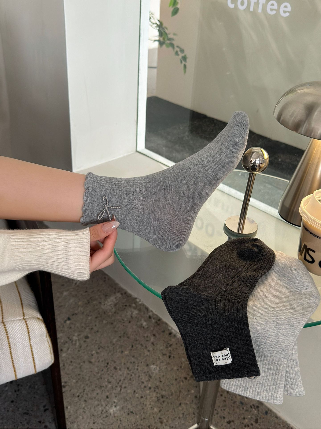 Dark Gray bow crew sock worn beside Black Gray and Light Gray styles
