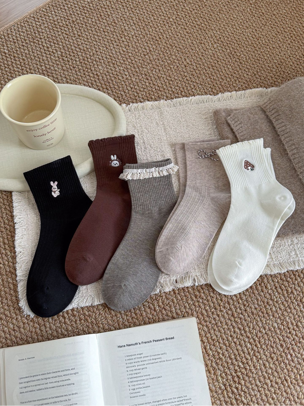 Ivory, Gray, Beige, Dark Brown and Black embroidered crew socks displayed together