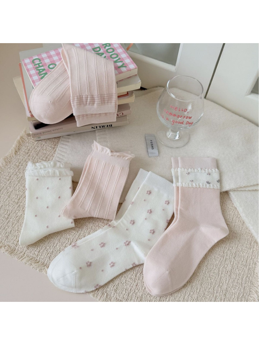 Five ivory and pink crew sock styles displayed together