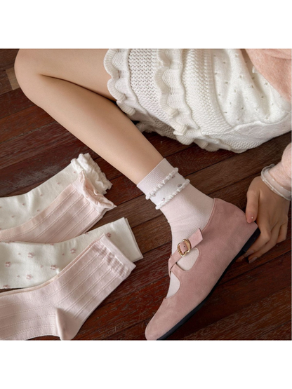 Pink Floral crew socks styled with pink shoes beside the coordinating sock collection