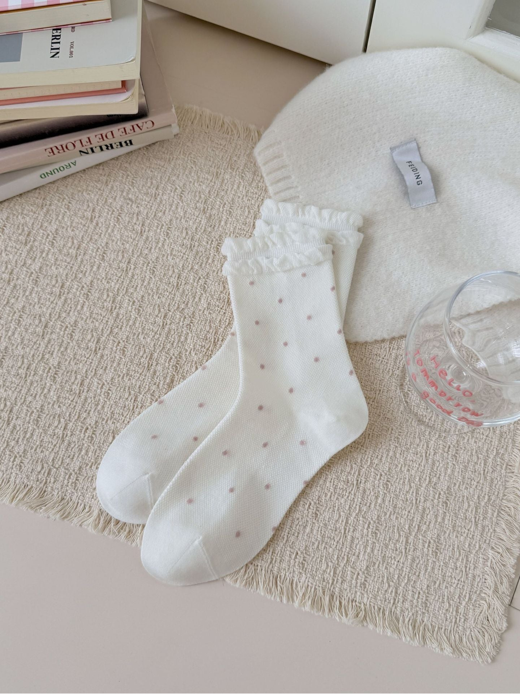 Ivory Dots crew socks with double ruffled cuffs, laid flat