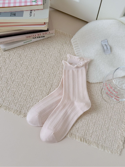 Pink Ruffle crew socks with ribbed bodies and rolled ruffle cuffs