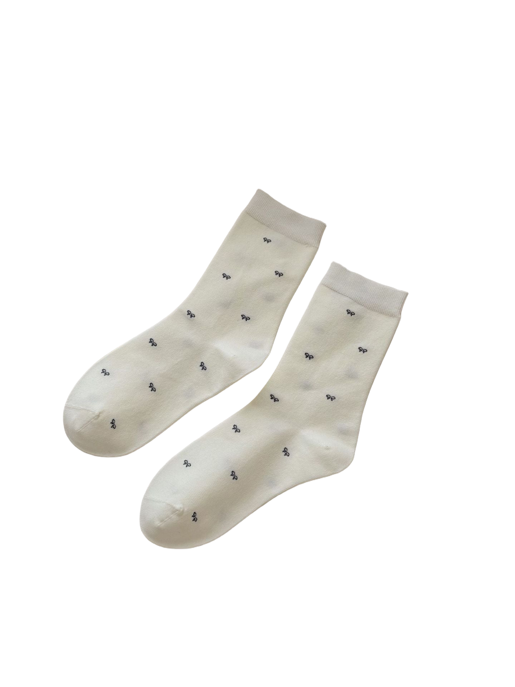 Ivory Tiny Bows crew socks with scattered dark bow motifs