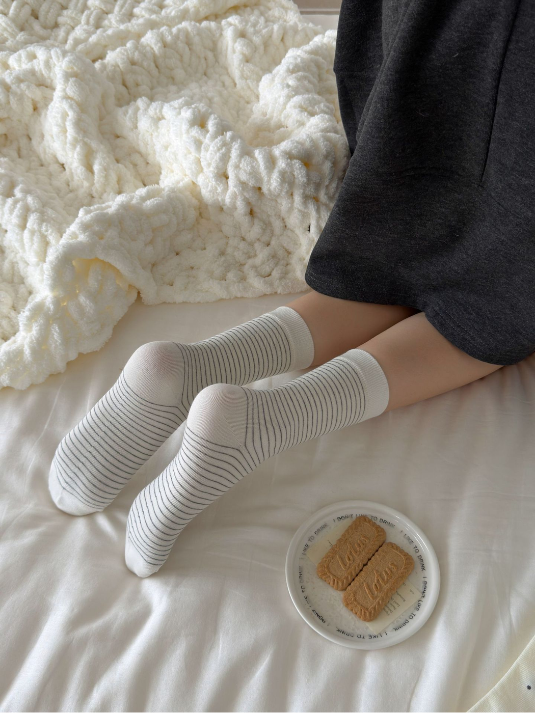 Fine stripe crew socks viewed from the soles, showing the continuous narrow stripe pattern