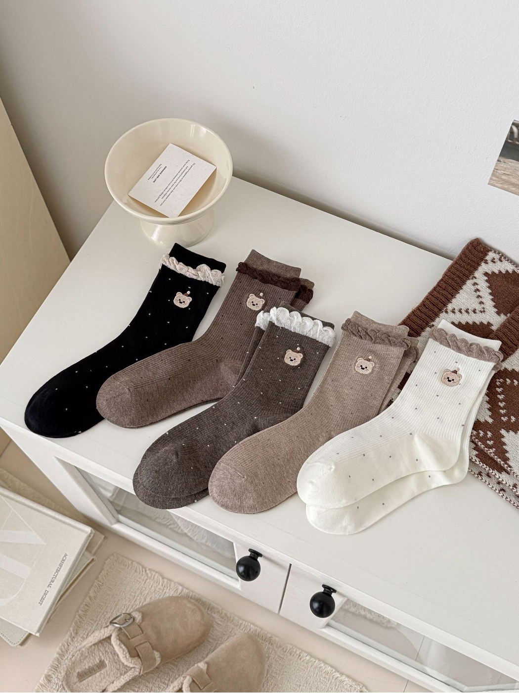 Five color variations of ruffled crew socks with embroidered bear faces