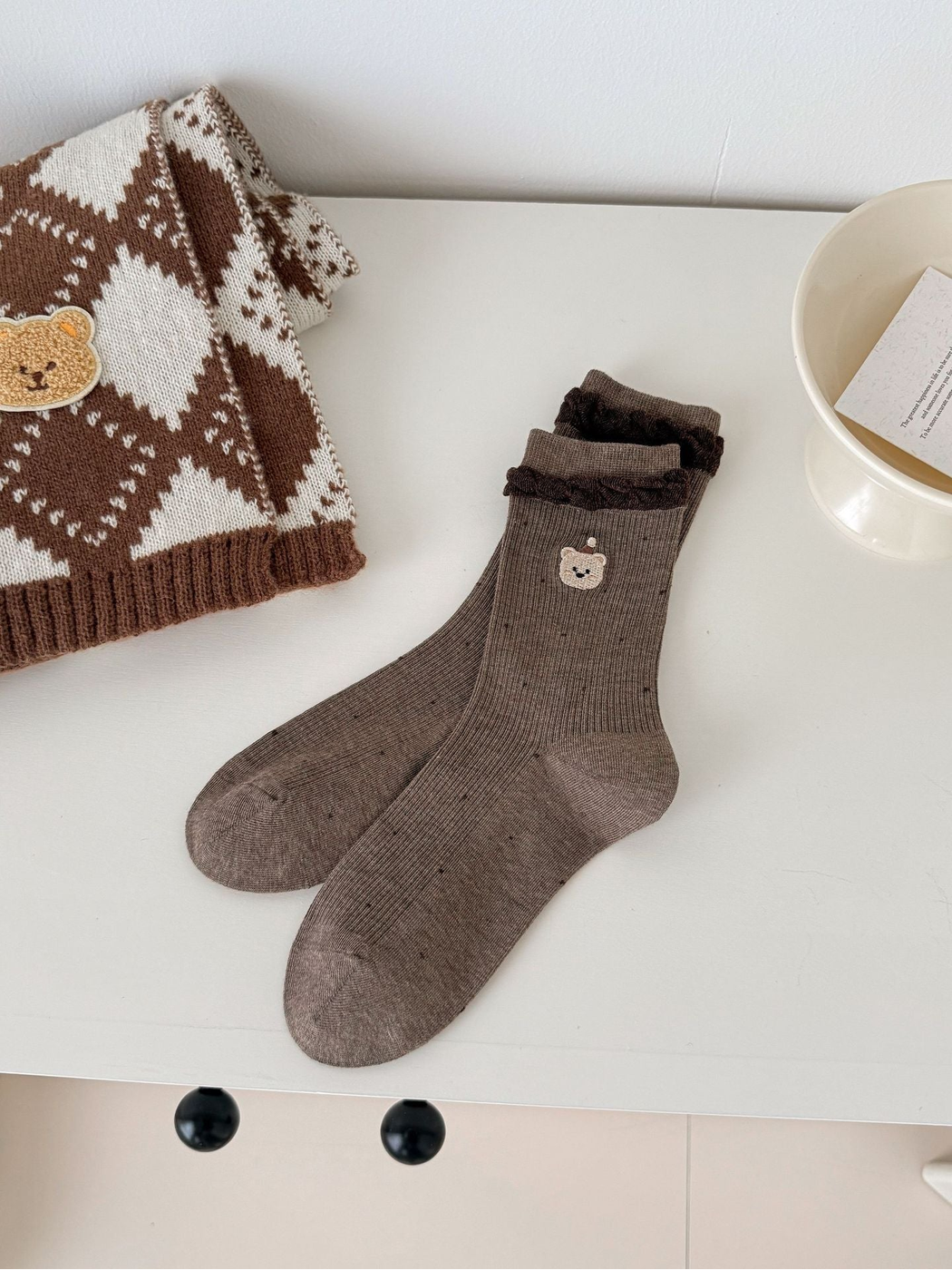 Coffee crew socks with dark ruffled cuffs and embroidered bear faces