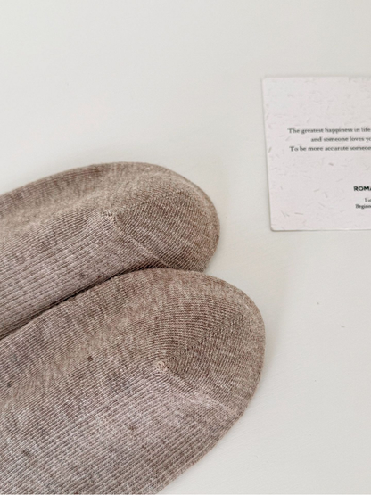 Close-up of the rounded toes and visible seams on Light Coffee socks