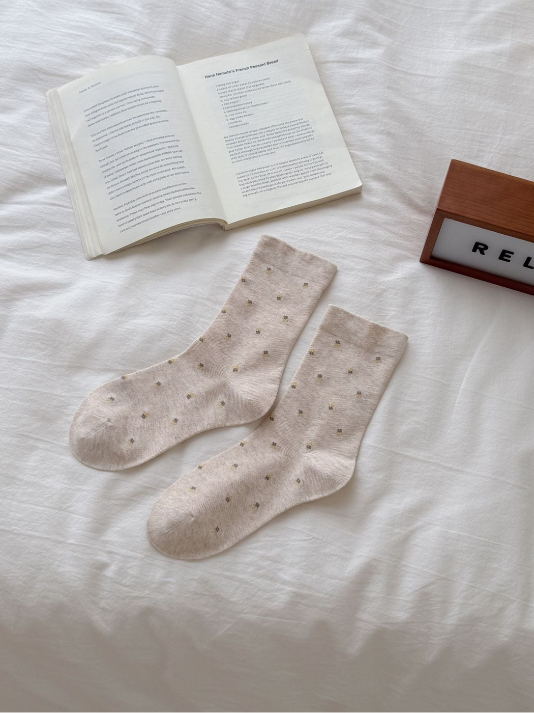 Beige crew socks with scattered yellow floral sprigs