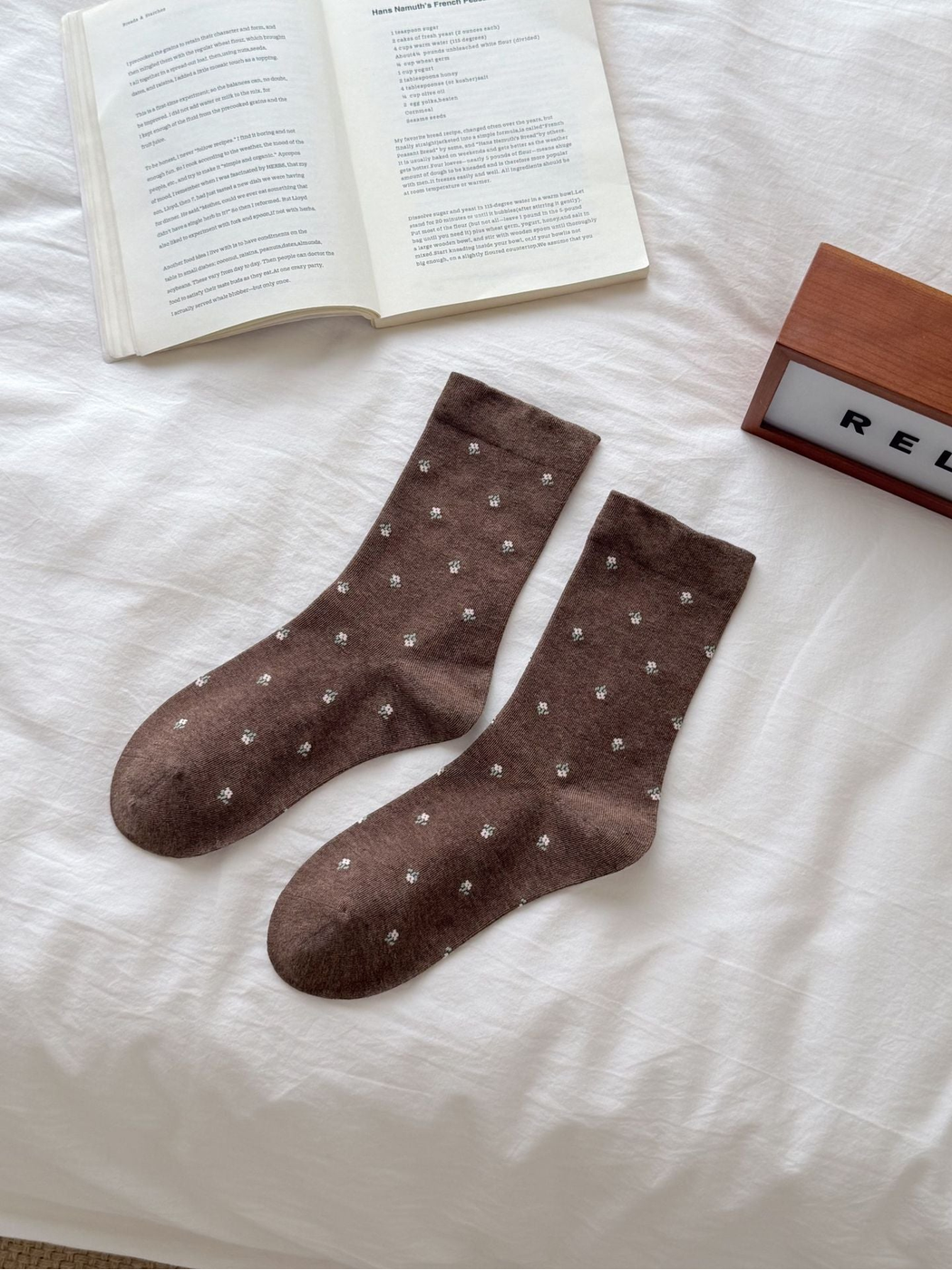 Coffee crew socks with scattered pale floral sprigs