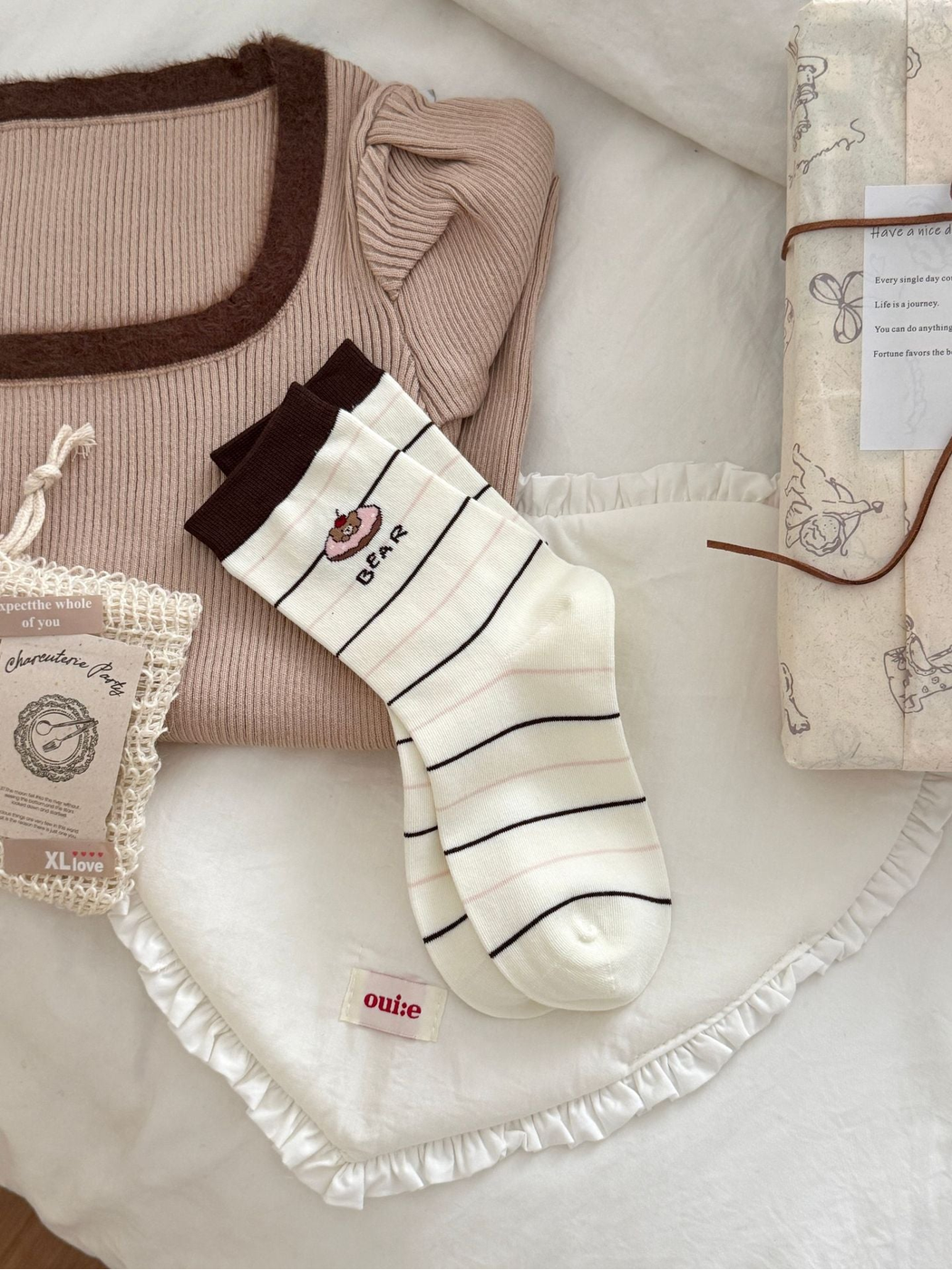 Striped Bear ivory crew socks with brown cuff, displayed as a pair