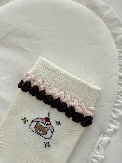 Close-up of the Ruffle Bear sock's pink and brown layered cuff trim