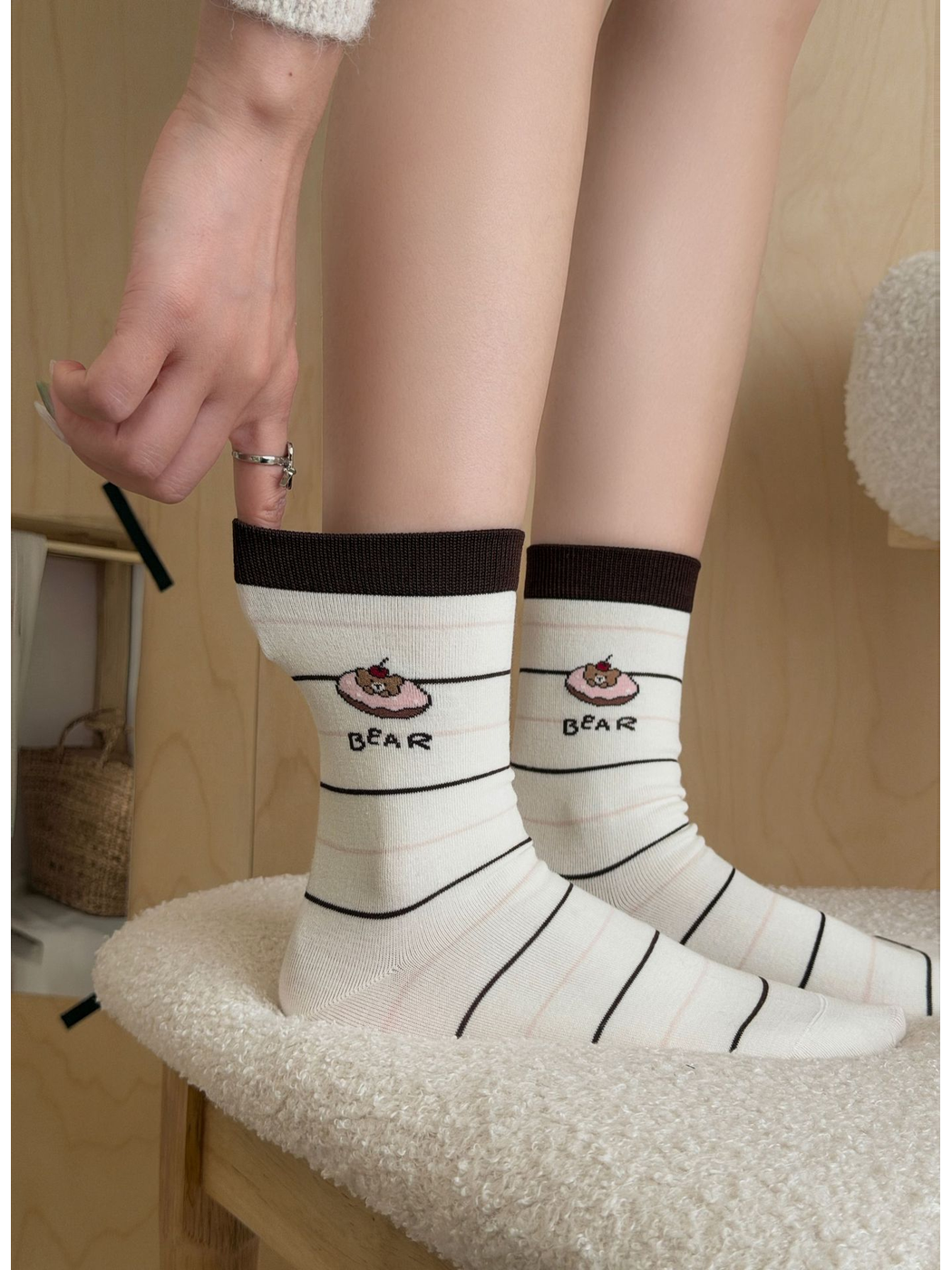 Striped Bear ivory crew socks worn together, close side view