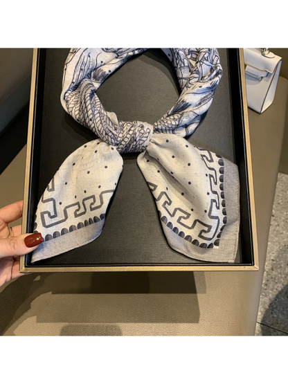Close-up of the scarf knot, dotted ends and geometric border