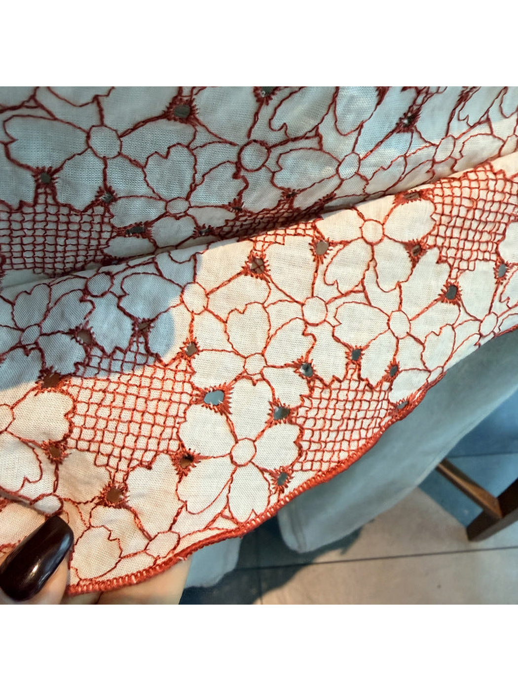 Close-up of Orange Red floral openwork and the narrow stitched scarf edge