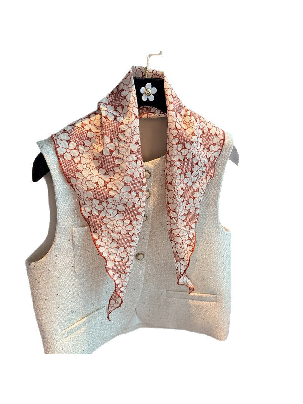 Orange Red floral triangle scarf draped over a white vest