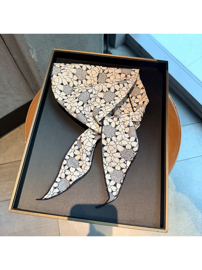 Dark Gray floral openwork triangle scarf displayed on a black tray