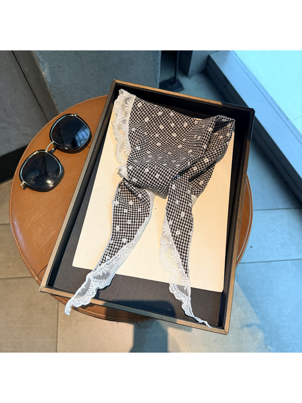 Black gingham triangle scarf with small floral motifs, tapered ties and scalloped lace trim