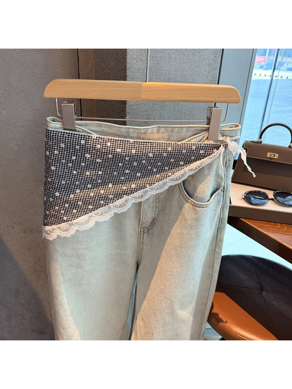 Black gingham triangle scarf with floral motifs and scalloped lace trim styled over light-wash jeans