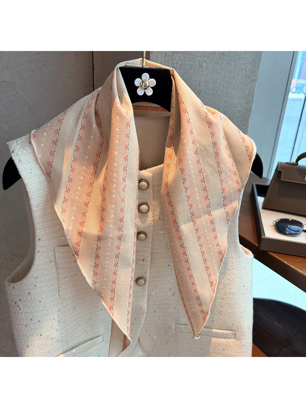 Close-up of the Blush scarf's dotted and floral stripe pattern