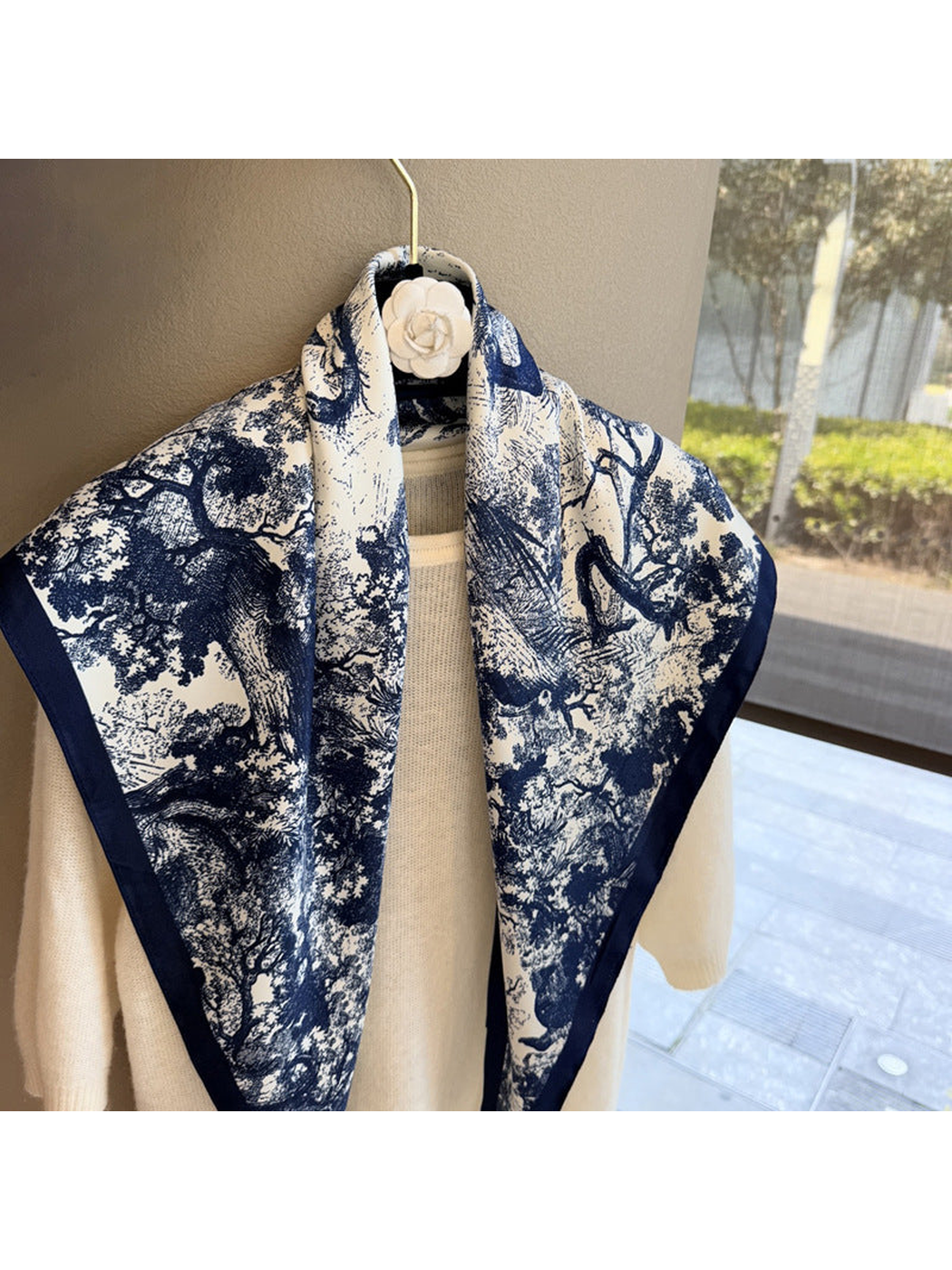 Close-up of the navy and ivory woodland pattern and navy border