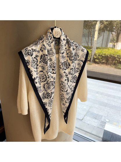 White paisley triangle scarf with dark border, full draped view