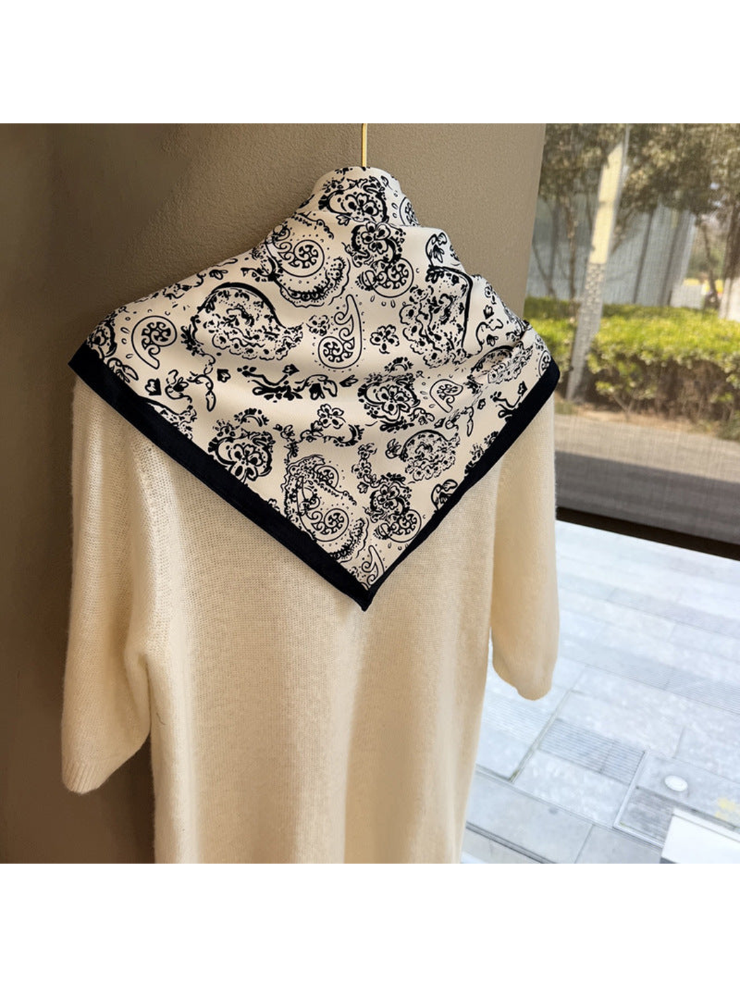 White paisley triangle scarf displayed from the back