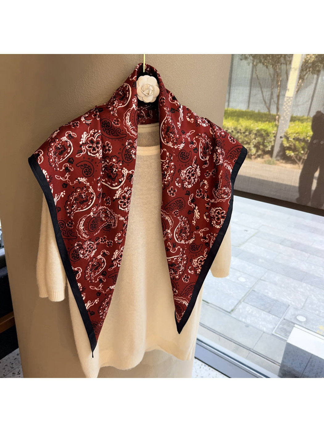 Burgundy paisley triangle scarf with dark border, full draped view