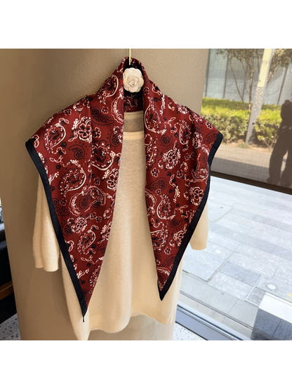Burgundy paisley triangle scarf with dark border, full draped view