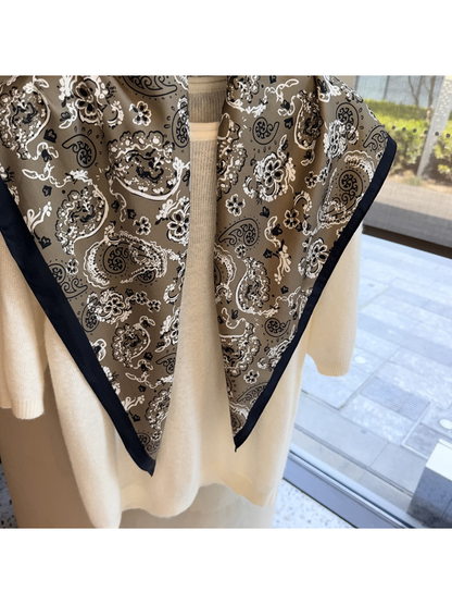 Close-up of the Khaki scarf's tapered ends and contrasting edge