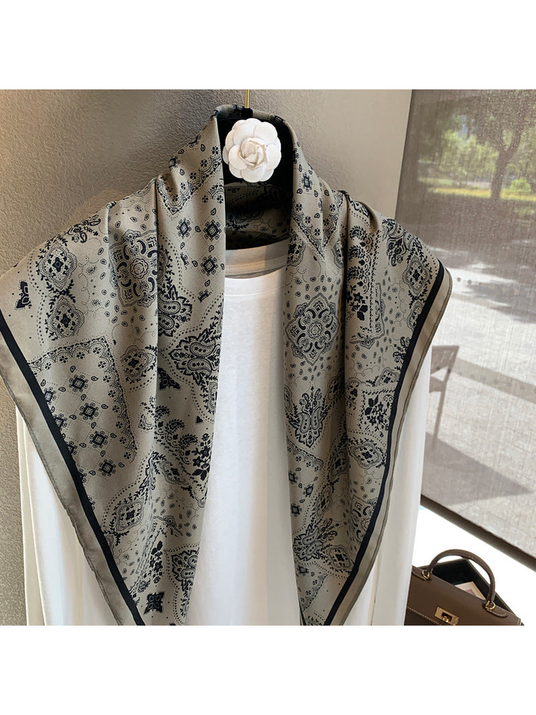 Close-up of the gray scarf's paisley and medallion pattern