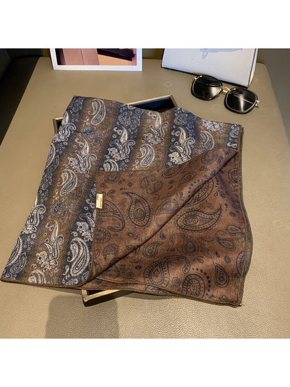 Close-up of the scarf front and contrasting brown reverse with paisley outlines