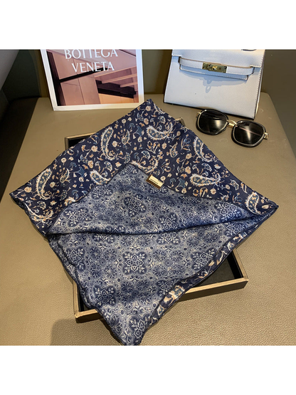 Close-up of the Navy scarf's paisley face and medallion-patterned reverse