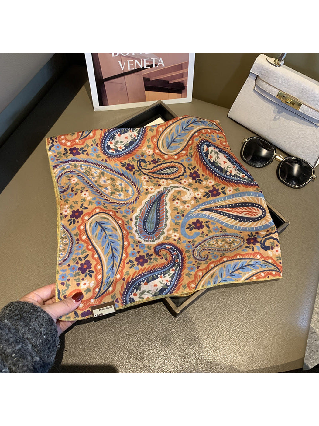 Beige square scarf opened to show the paisley and floral pattern