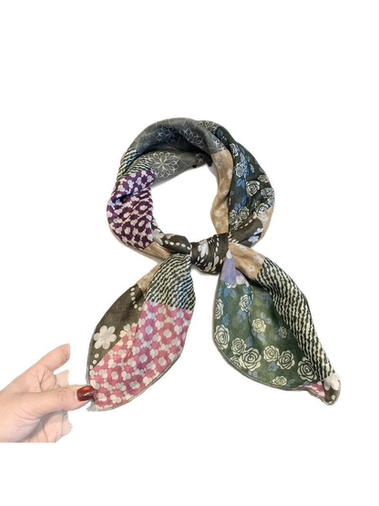 Green floral patchwork scarf tied in a loose knot, full view