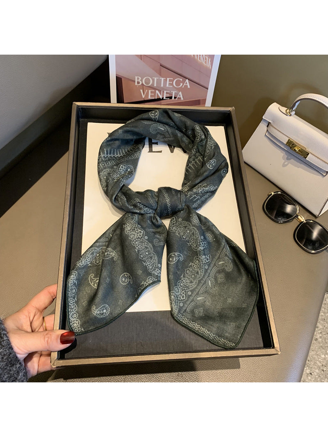 Army Green paisley scarf tied in a looped knot