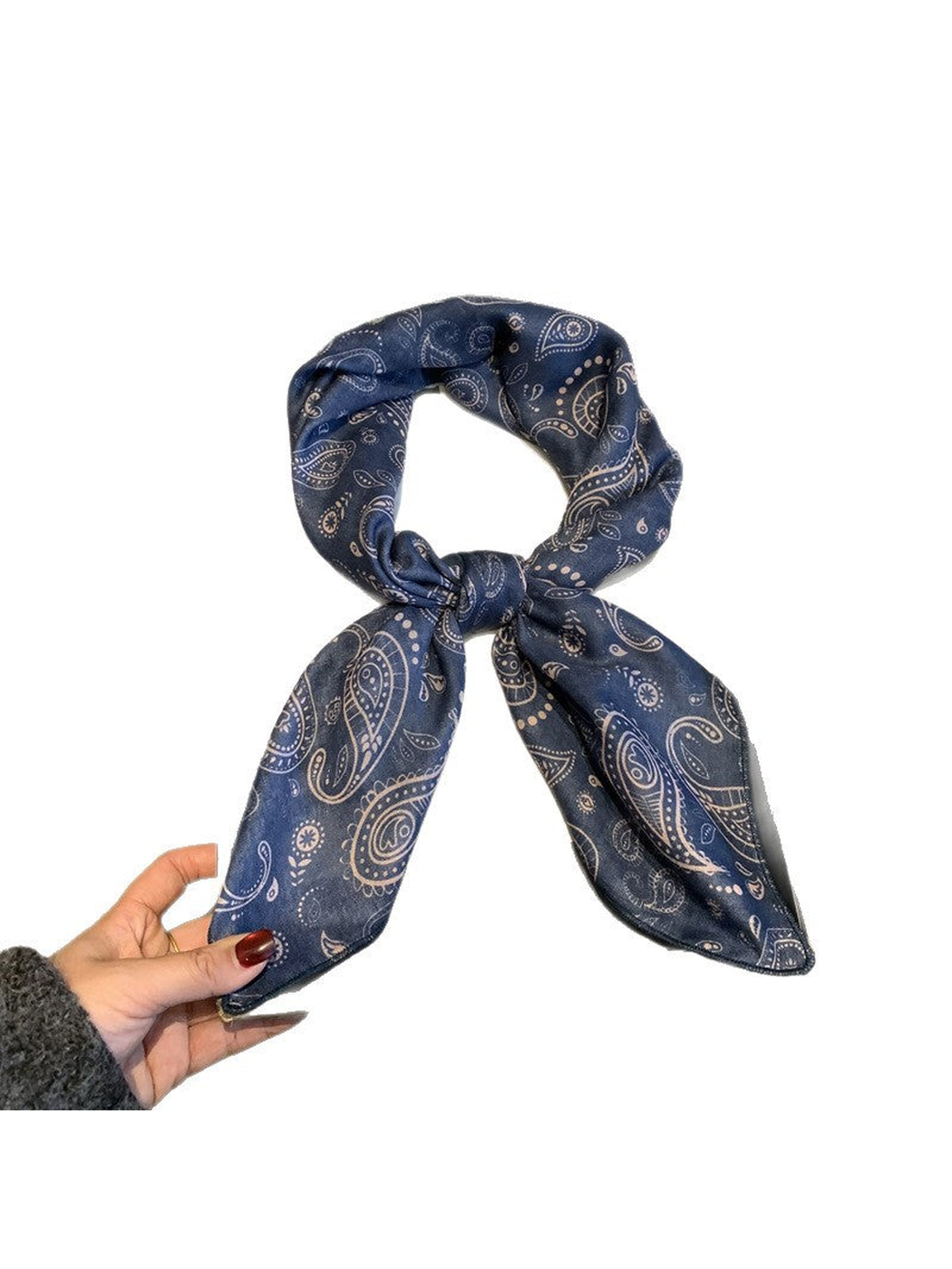 Navy paisley scarf tied in a loop on a white background