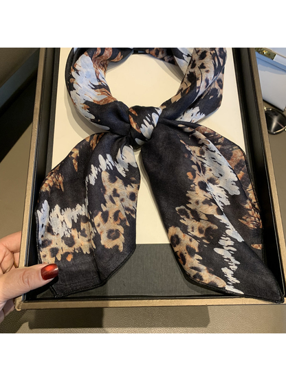 Close-up of the scarf knot, pointed ends and narrow stitched edges