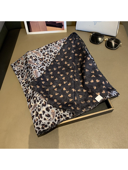 Close-up of the scarf's gray printed face and contrasting dark reverse