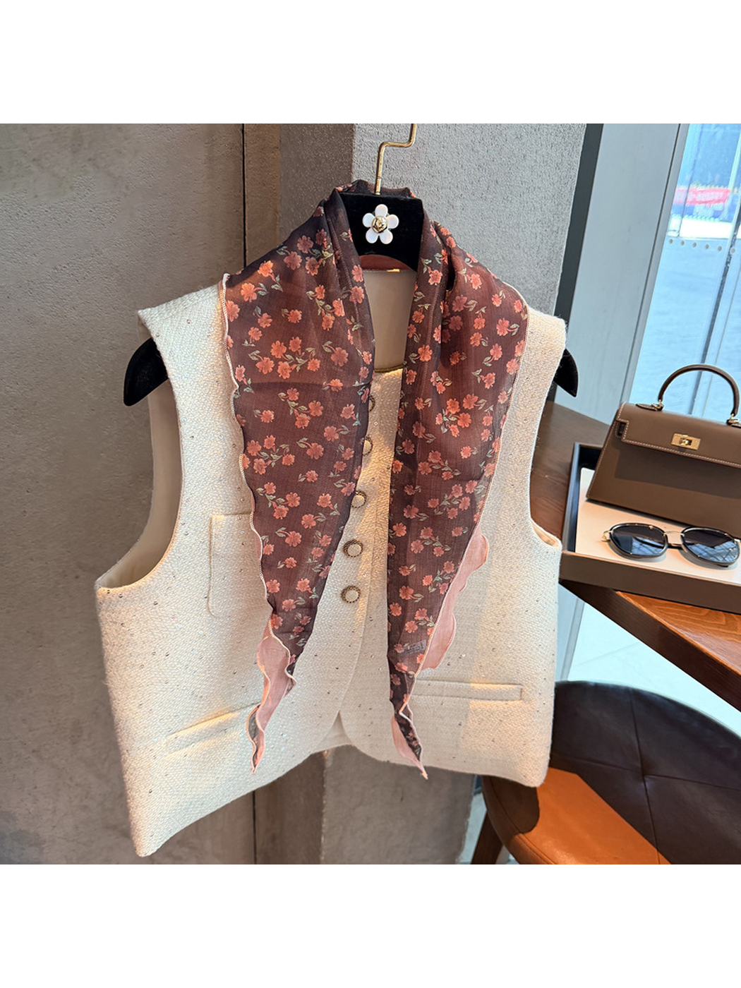 Red Pink floral triangle scarf draped over a cream vest
