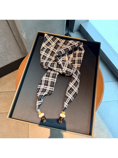 Black plaid scarf with tapered ends and bead accents, full view