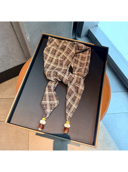 Khaki plaid scarf with tapered ends and bead accents, full view