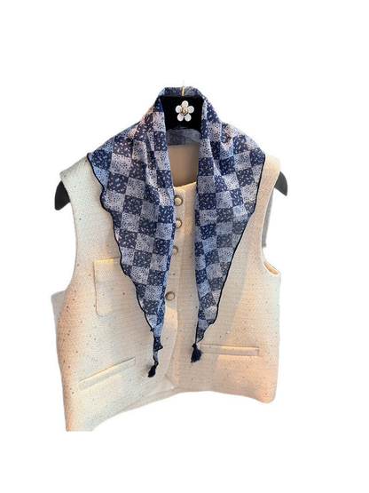 Navy checkerboard floral triangle scarf with tassel ends, front draped view
