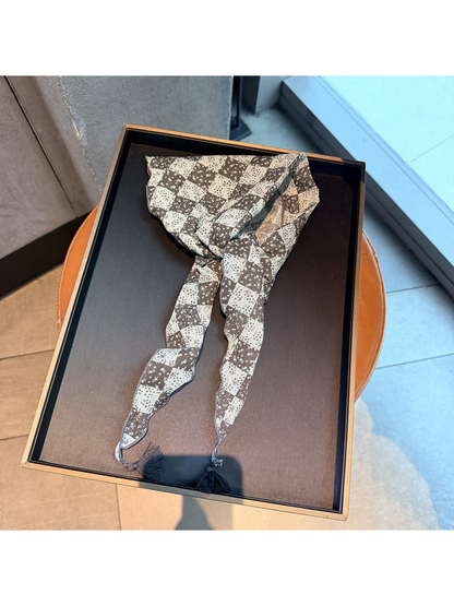 Gray checkerboard floral triangle scarf with tassel ends, tied display