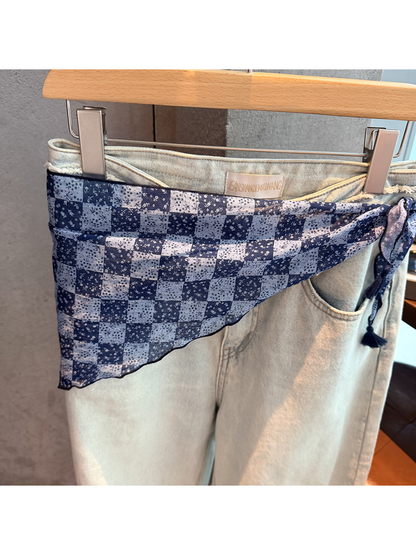 Close-up of the navy floral checkerboard pattern and semi-sheer finish
