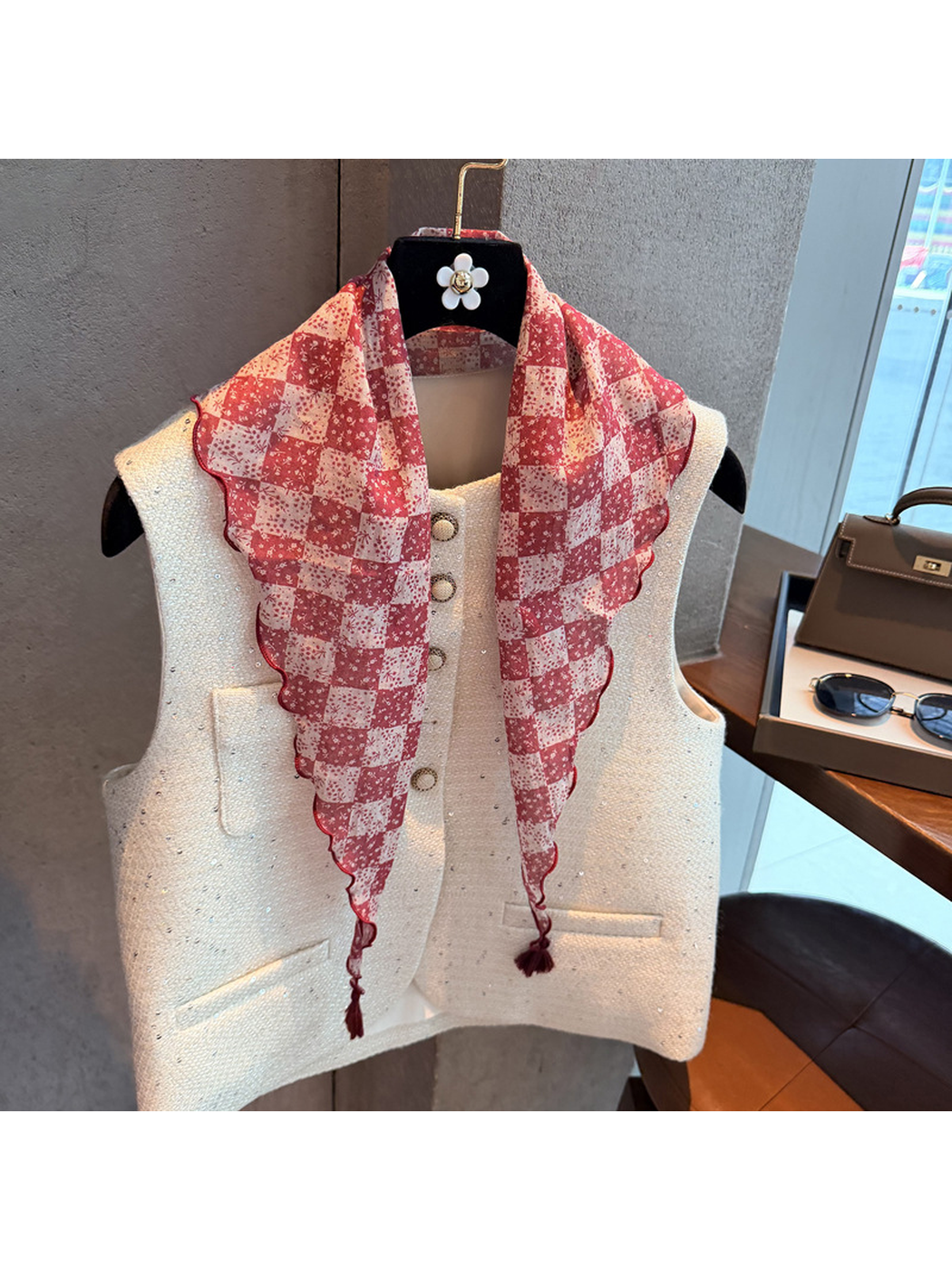 Red checkerboard floral triangle scarf with scalloped edges and tassel ends